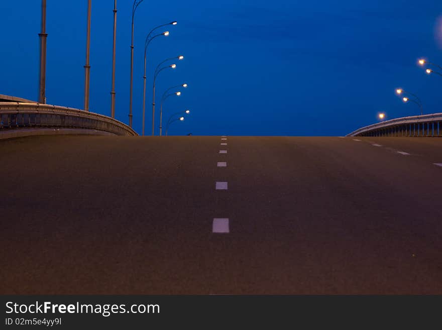 Nightly road through a bridge, emptily