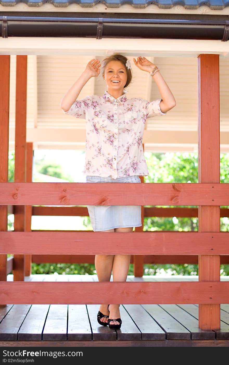 Girl standing on a veranda outdoor