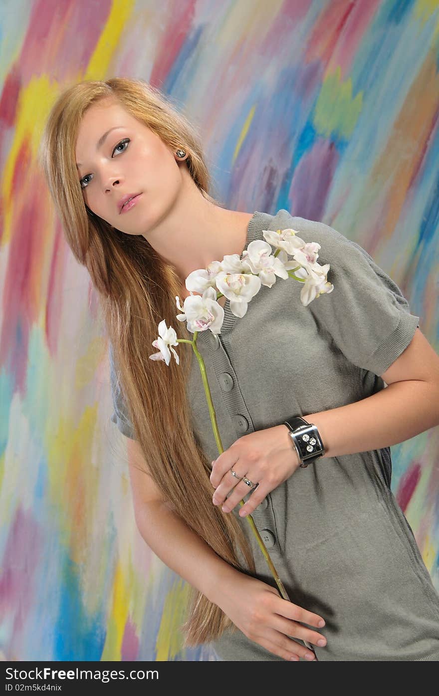 Portrait of beautiful girl with white orchid