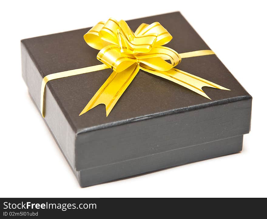 Black gift box with golden ribbon isolate on white