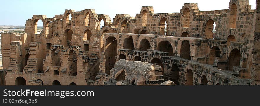 View to the arches from court yard of coloseum in the village of Jem in Tunisia. View to the arches from court yard of coloseum in the village of Jem in Tunisia