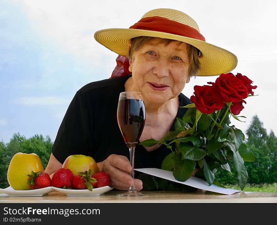 Happy senior woman outdoors in summer