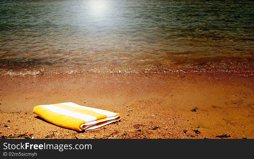 Turquoise sea and towel.