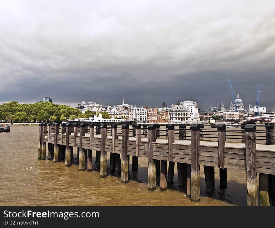 London city view river thames with pier in stormy weather. London city view river thames with pier in stormy weather