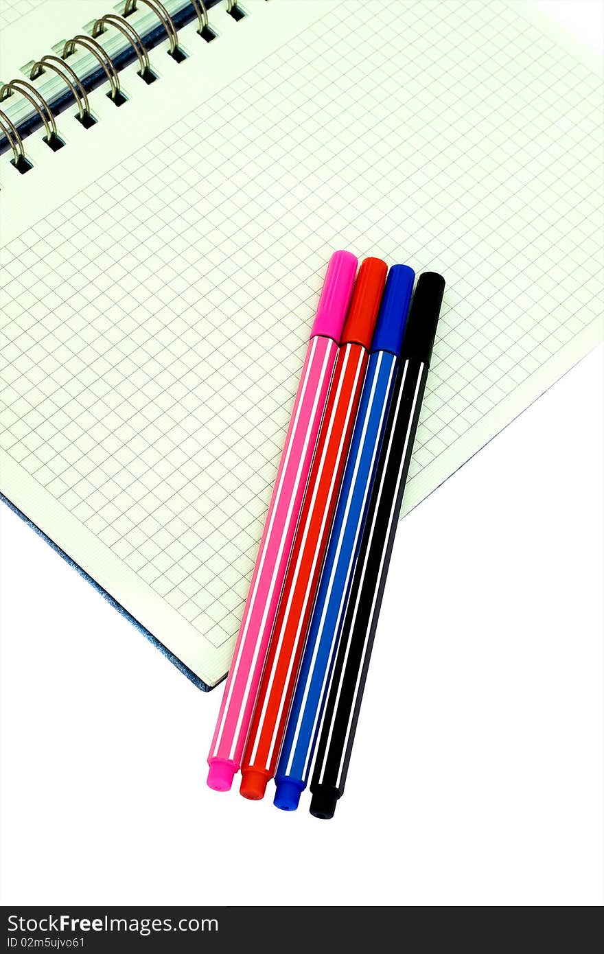 Squared Notebook and Colorful Pens. Squared Notebook and Colorful Pens