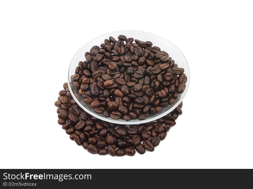 Coffee beans on a plate, white background isolated