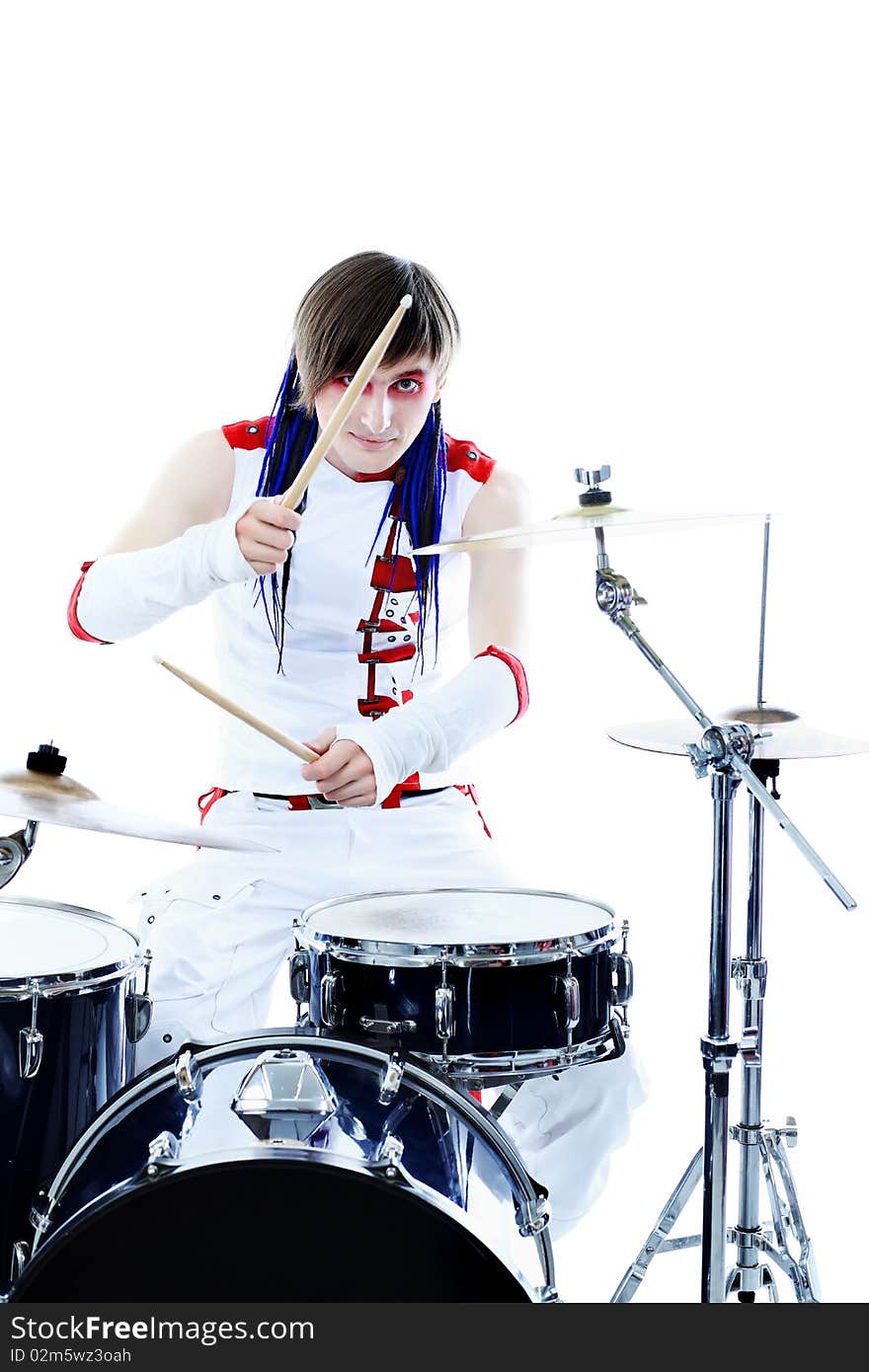 Rock drummer is playing his instruments. Shot in a studio. Rock drummer is playing his instruments. Shot in a studio.