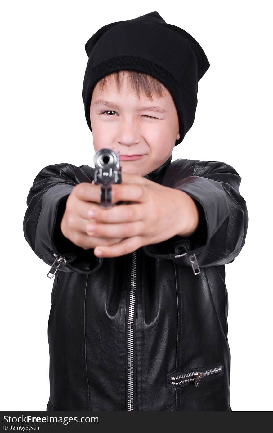 Young boy pointing gun, focus on boys face, isolated