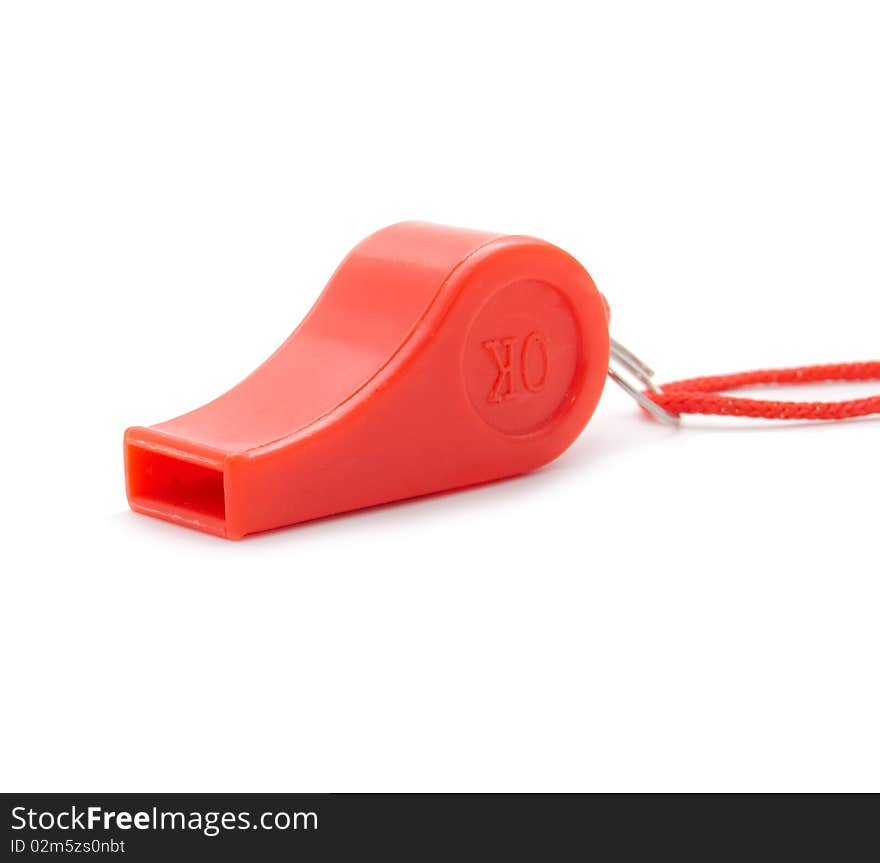 Red whistle with a rope on a white background