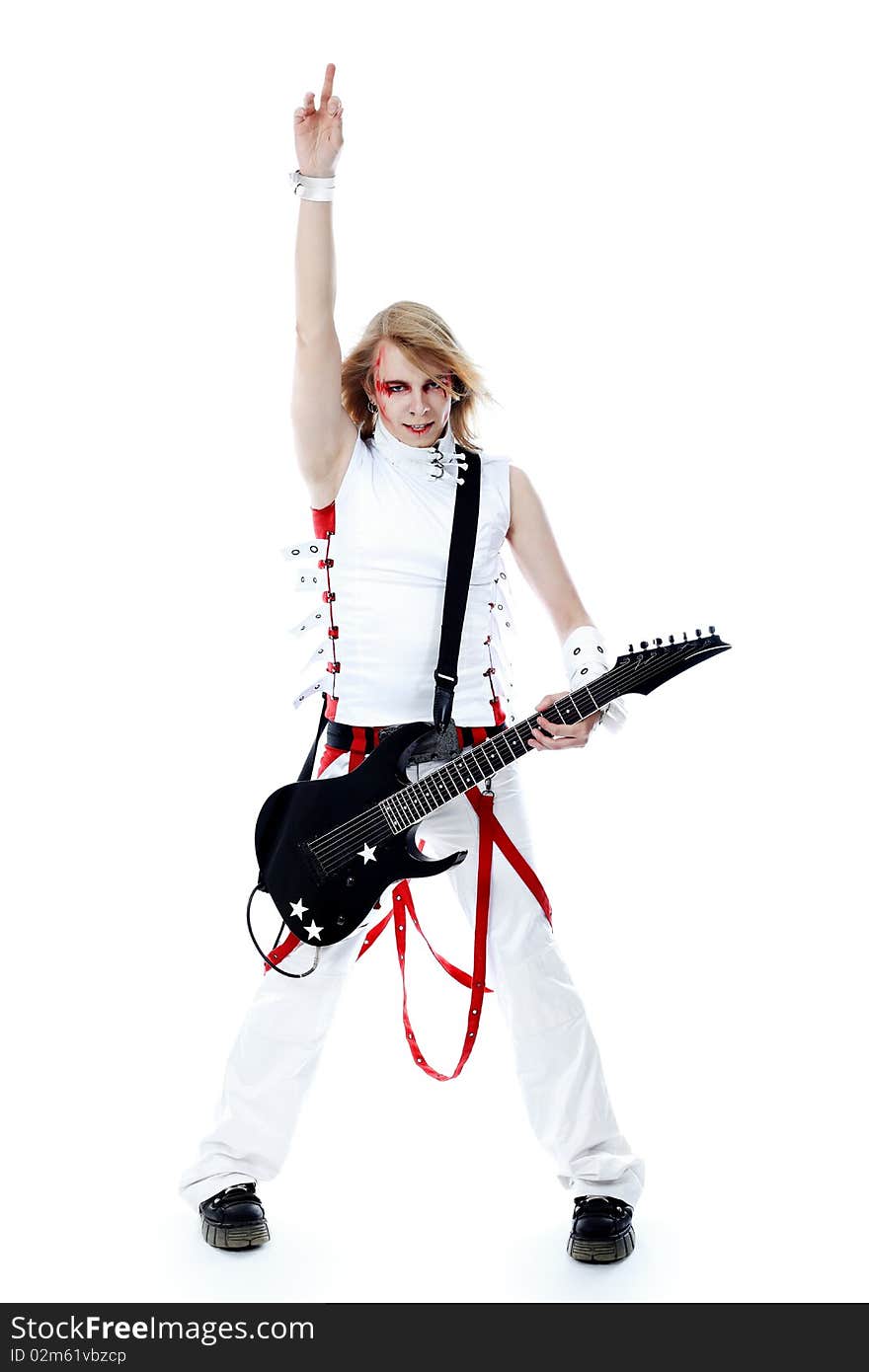 Rock musician is playing electrical guitar. Shot in a studio. Rock musician is playing electrical guitar. Shot in a studio.