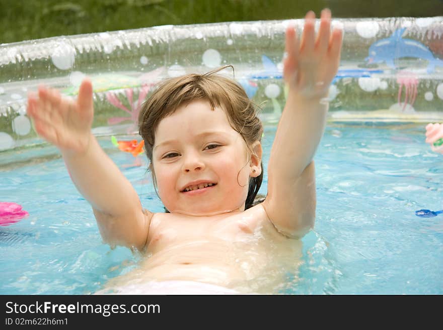 The beautiful child in pool