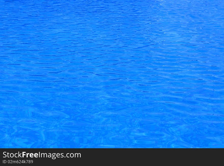 Blue water texture under the summer sky. Blue water texture under the summer sky