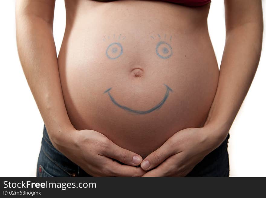 Pregnant belly with painted smile. Pregnant belly with painted smile