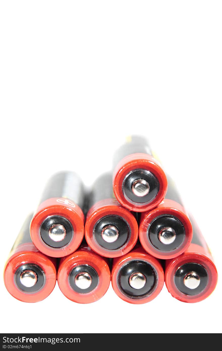 Batteries grouped together against a white background. Batteries grouped together against a white background