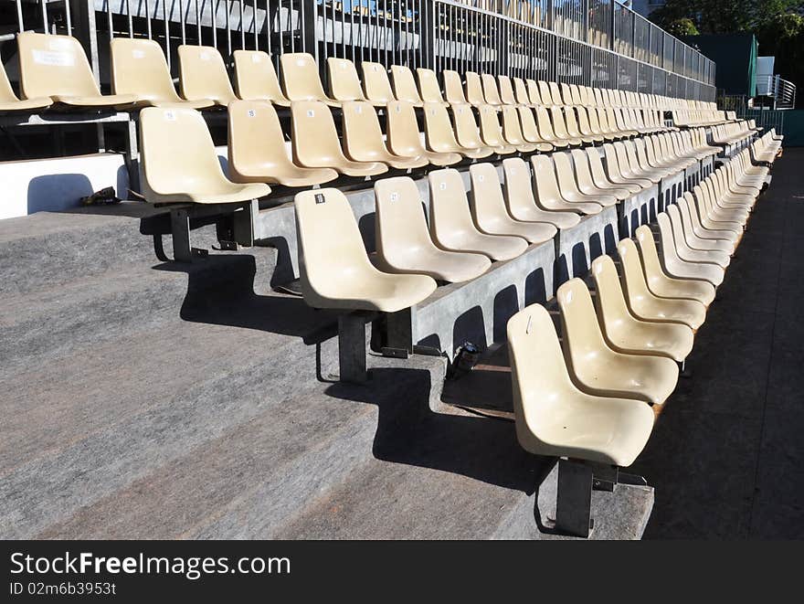 An alignment of plastic chairs. An alignment of plastic chairs