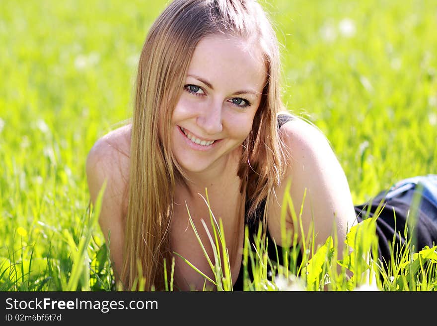 Happy woman on the green grass