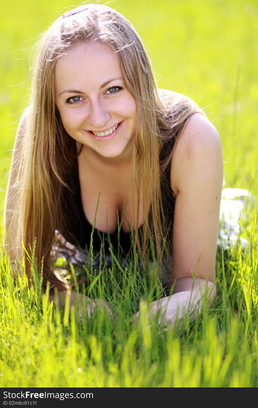 Happy woman on the green grass