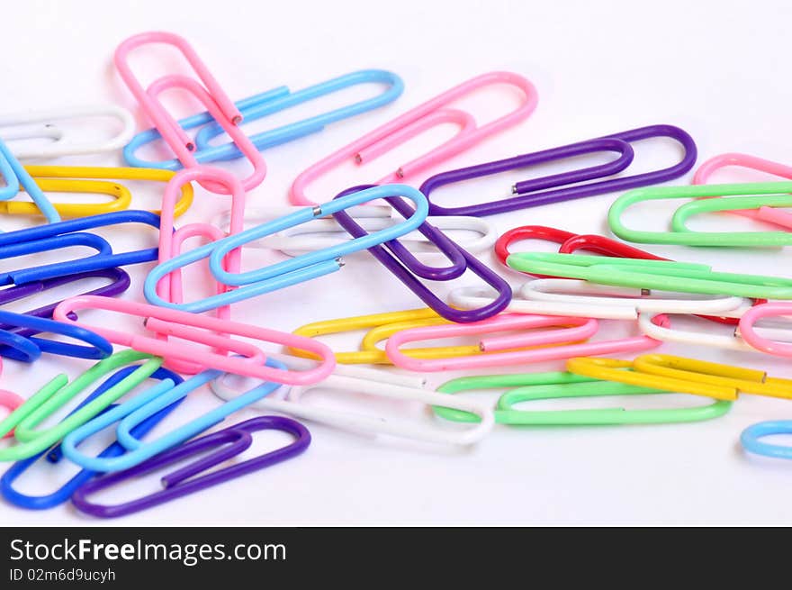 Colorful paper clips isolated on white background