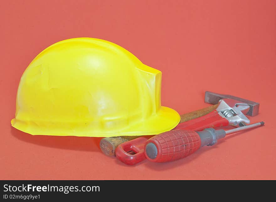 Helmet are yellow with red background tools. Helmet are yellow with red background tools