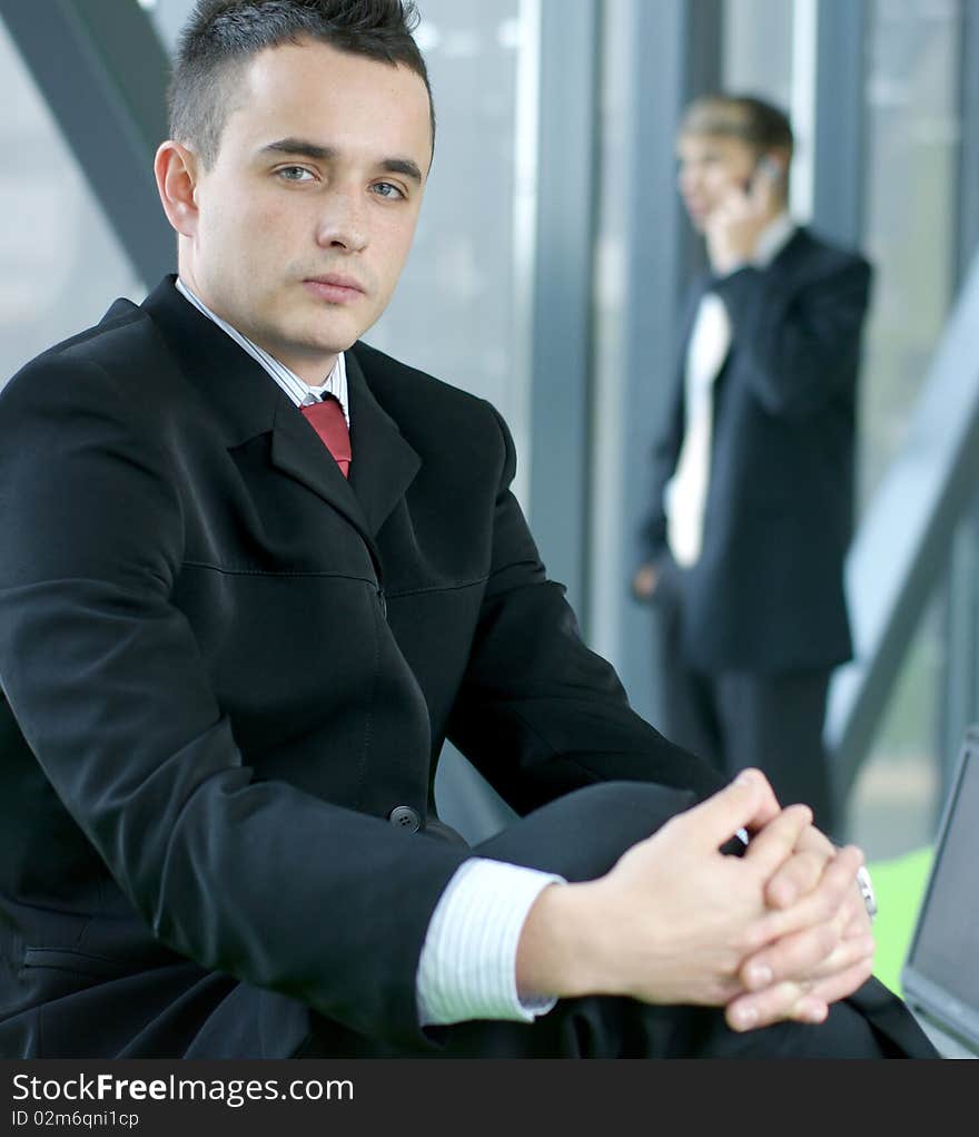 Portrait of a young business man in an office