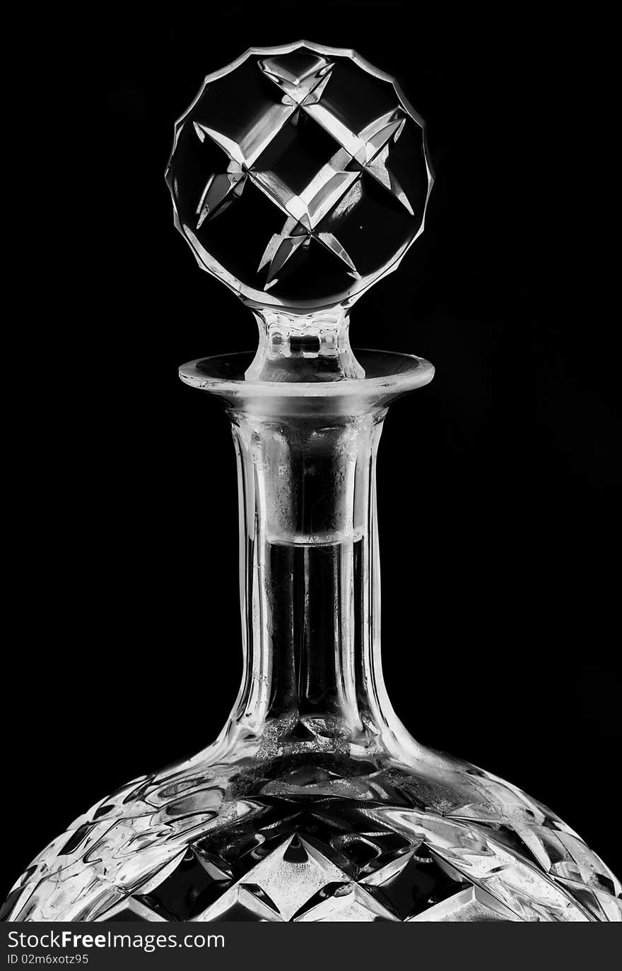 A glass alcohol container / decanter against a white background