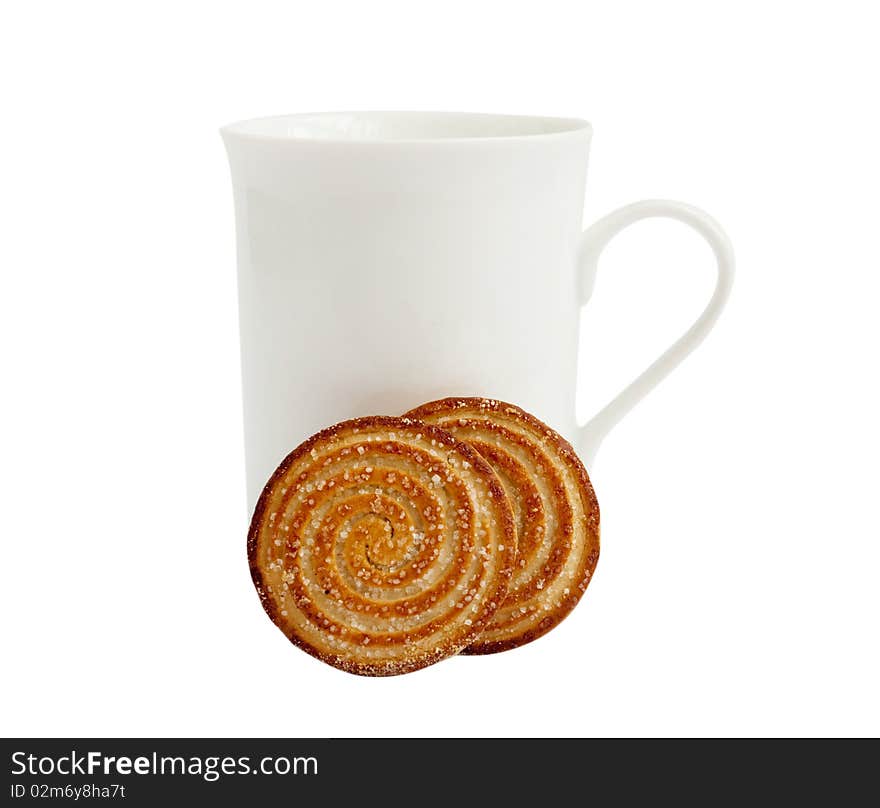 White cup with cookies on a white background