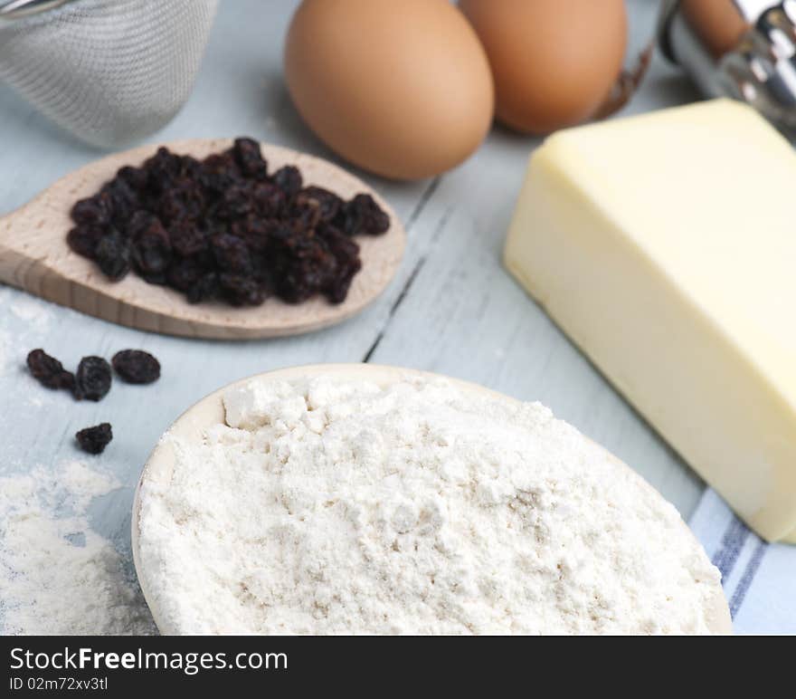 Baking Ingredients Laid Out On A Wooden Kitchen Table. Baking Ingredients Laid Out On A Wooden Kitchen Table