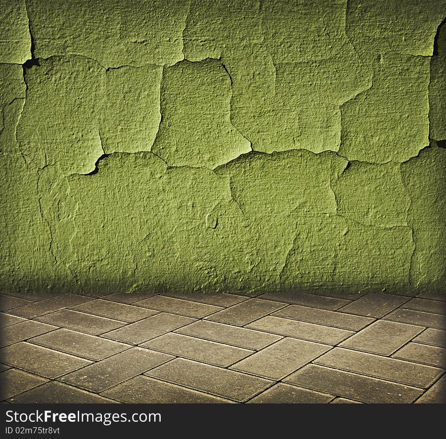 Vintage interior with green cracked wall