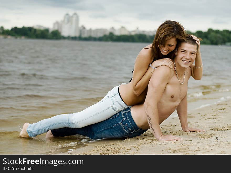 Couple on a river bank