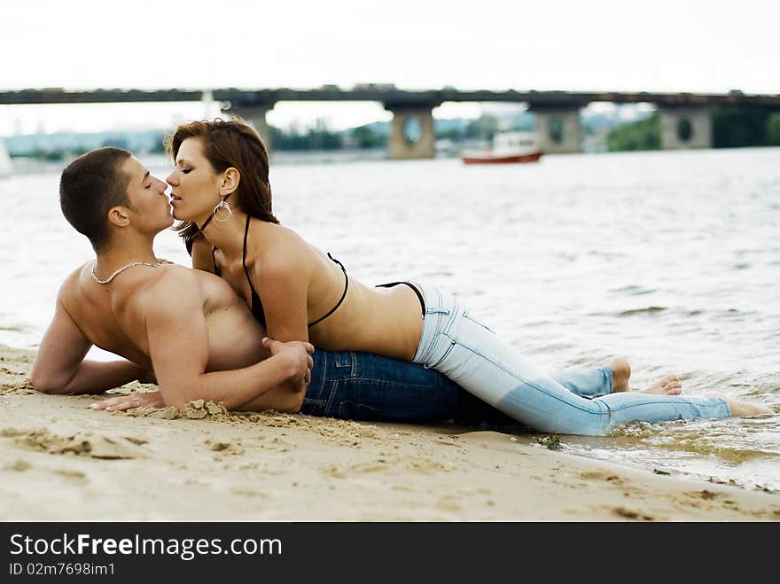 Couple on a river bank