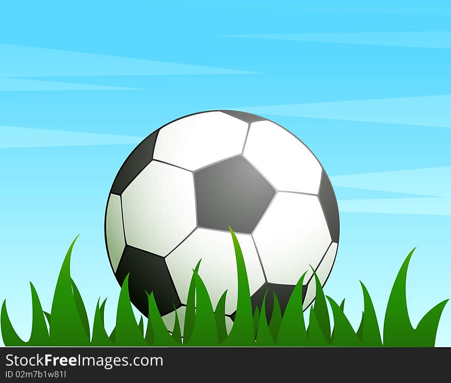 Football on a green grass for a design