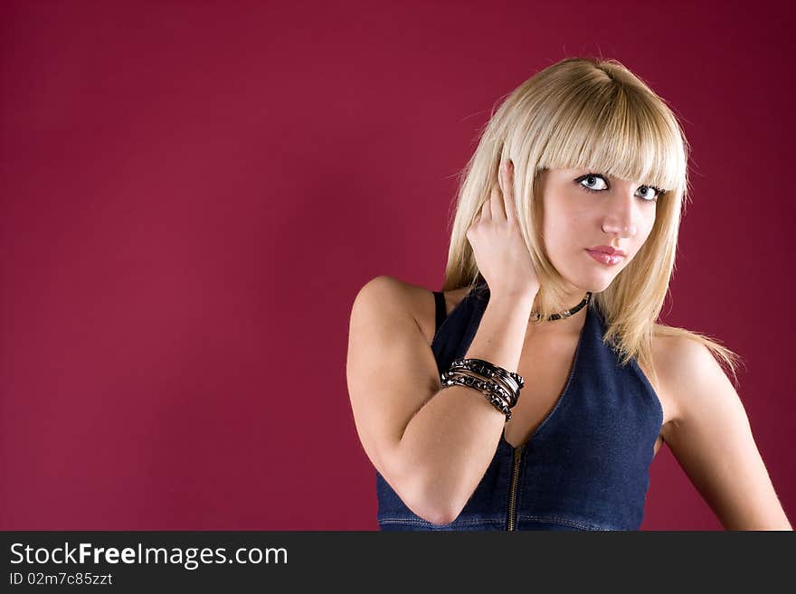 Image of friendly blond over red background. Image of friendly blond over red background