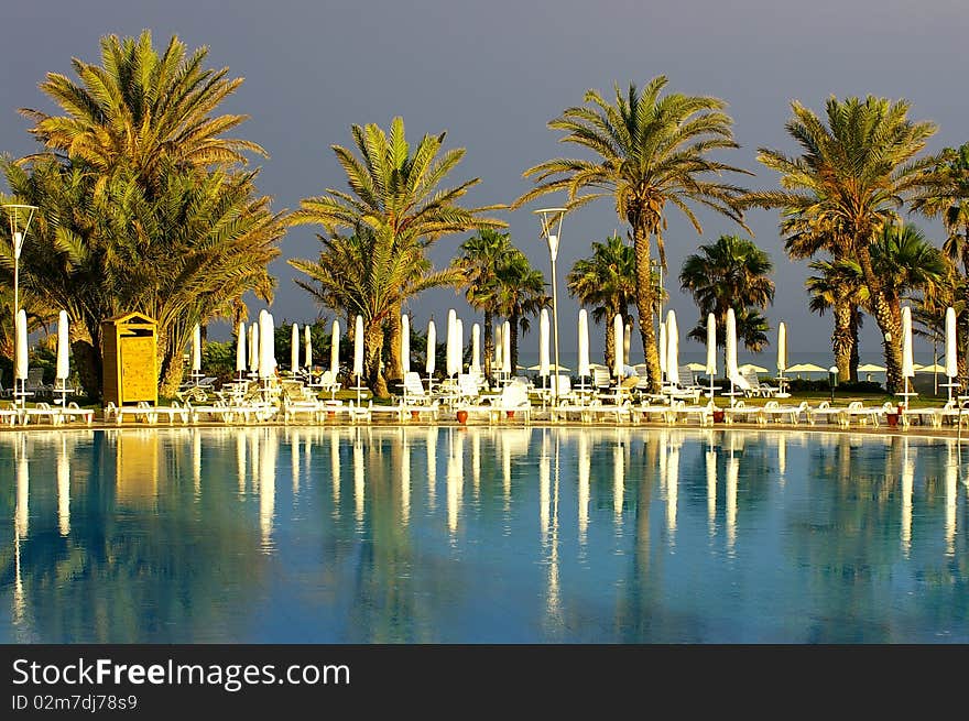 Pool and palm after the rain in Turkey