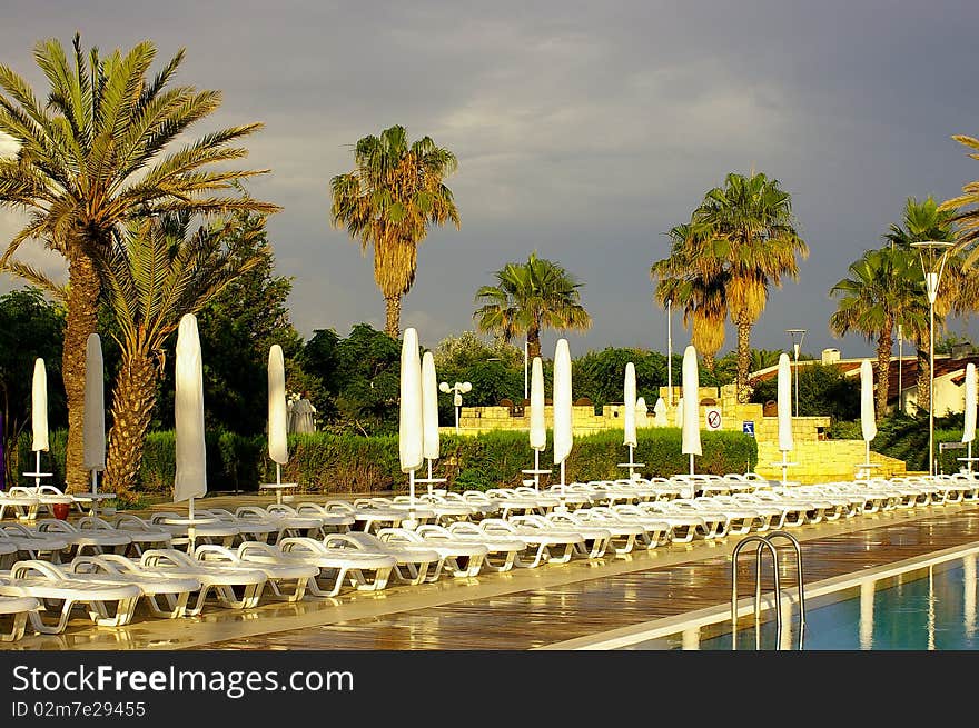 Empty chaise longues after the rain in Turkey