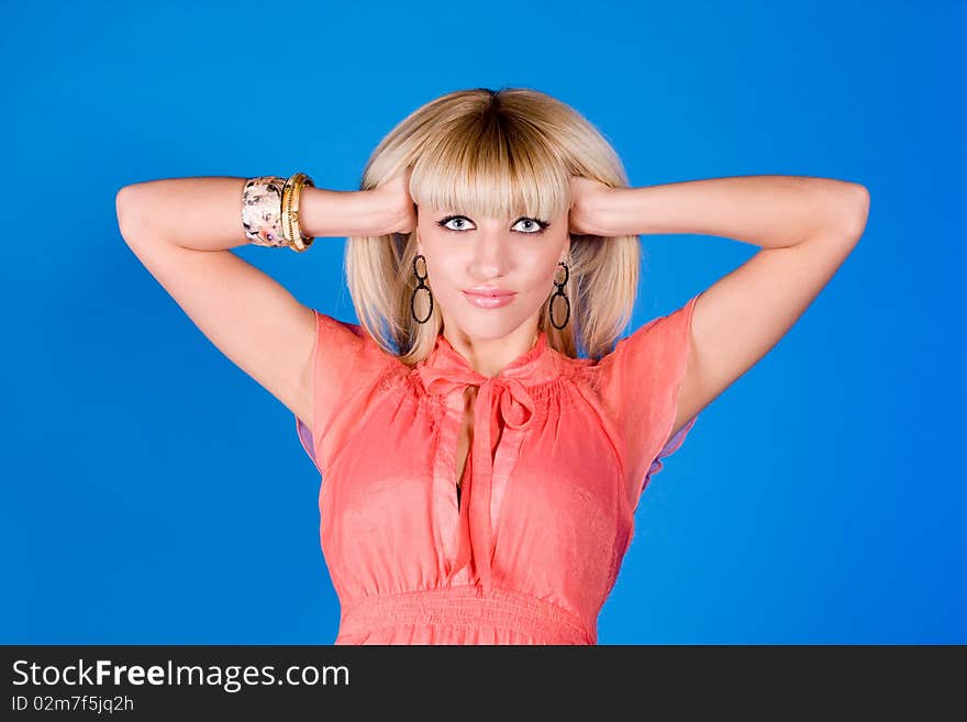 Beautiful blonde on a blue background. Beautiful blonde on a blue background