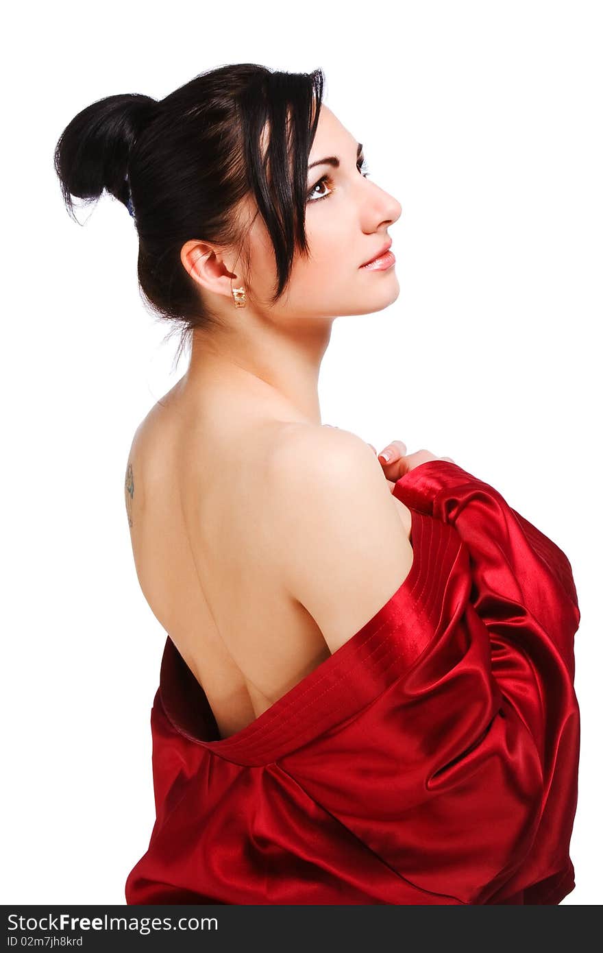 Attractive young naked woman in red gown