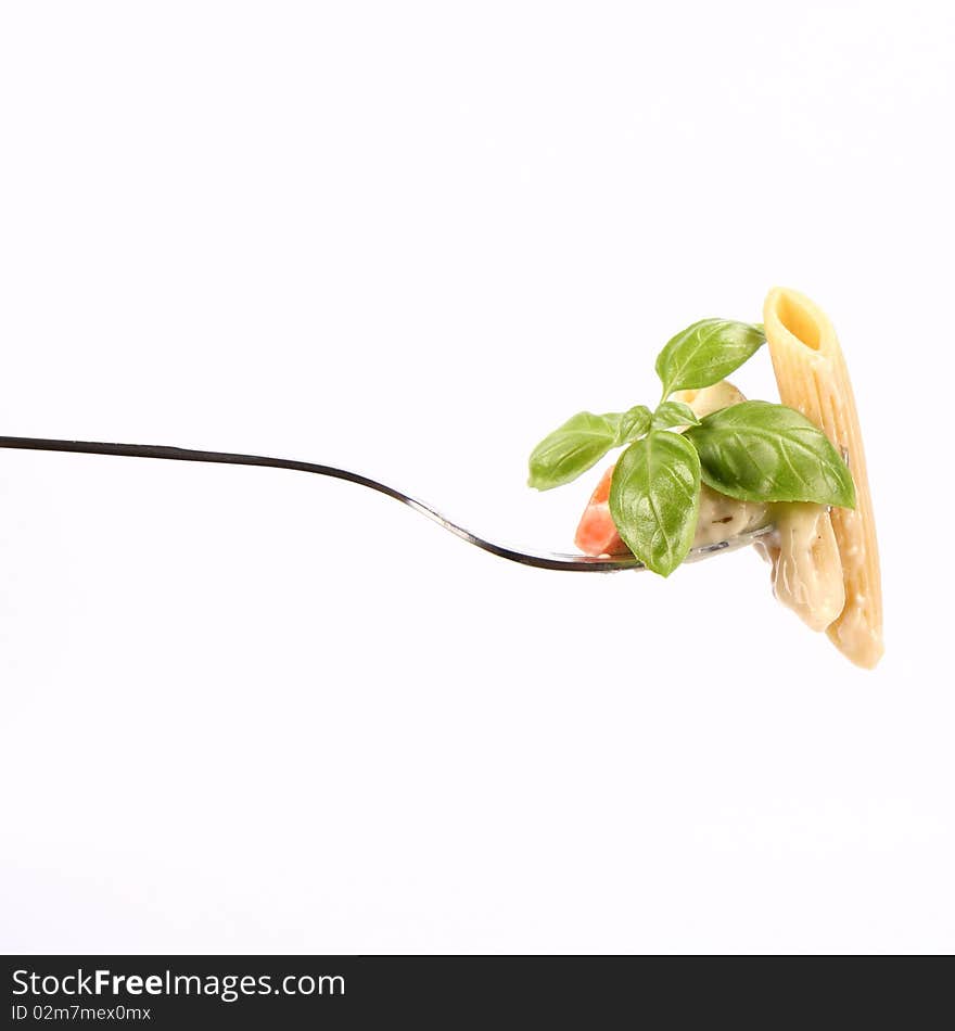 Penne with white sauce on a fork