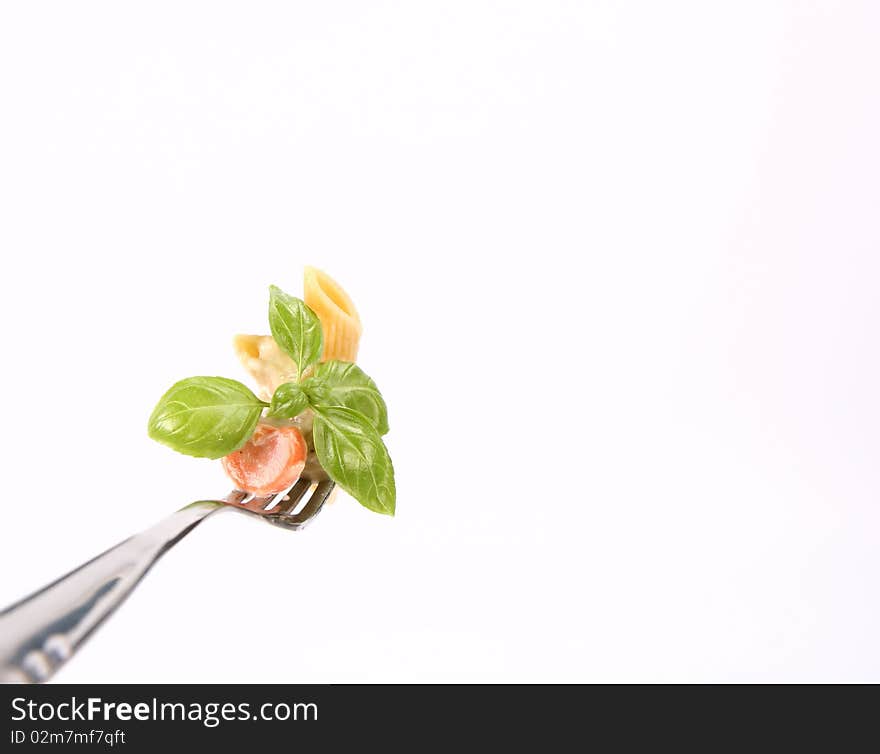 Penne with white sauce on a fork