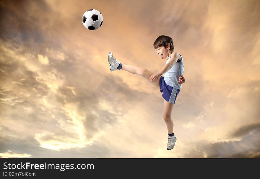 Child shooting a foot ball. Child shooting a foot ball