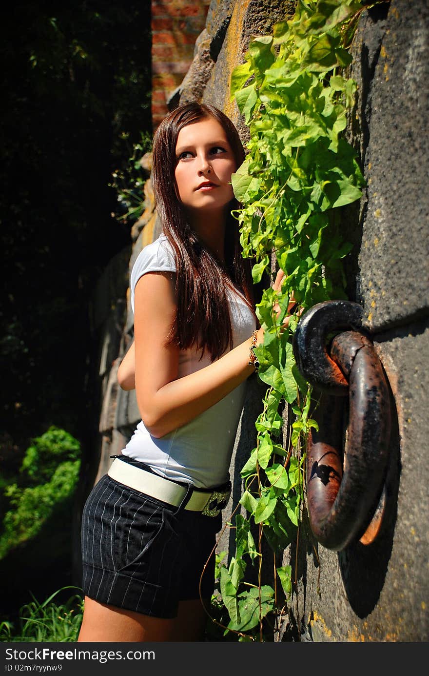 Beautiful lady in the old garden.