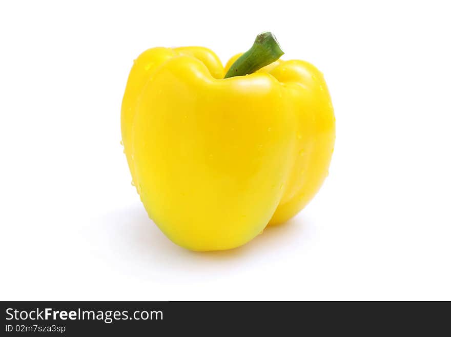 Close up of a yellow pepper isolated on white background.