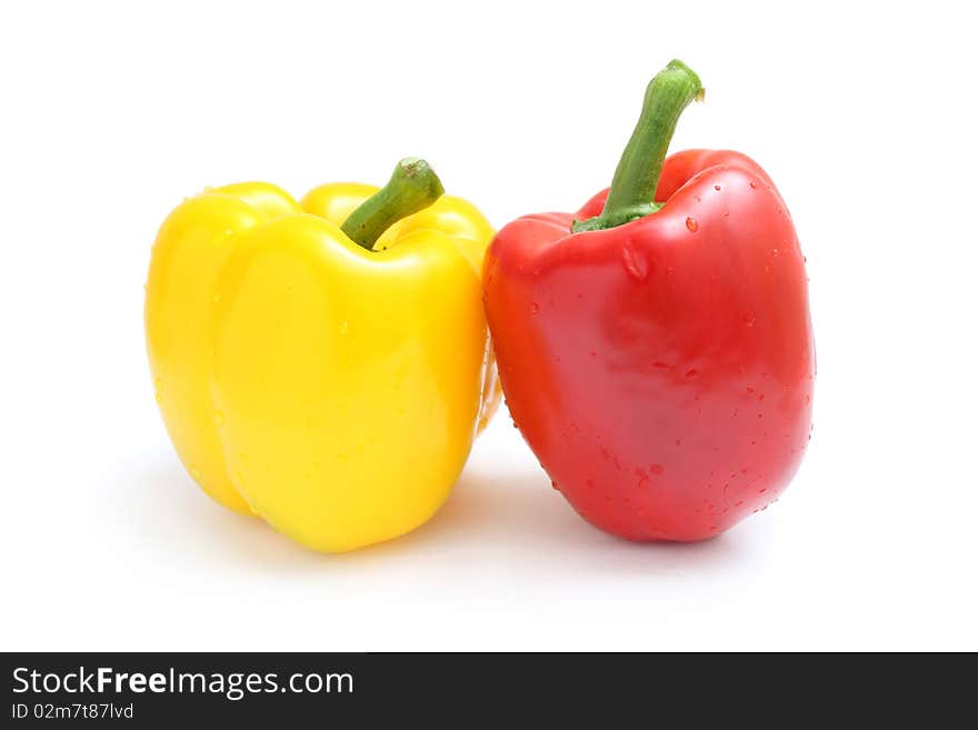 Close up of yellow and red pepper isolated on white background. Close up of yellow and red pepper isolated on white background.