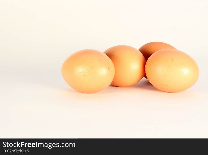 Four brown eggs isolated on a white background. Four brown eggs isolated on a white background