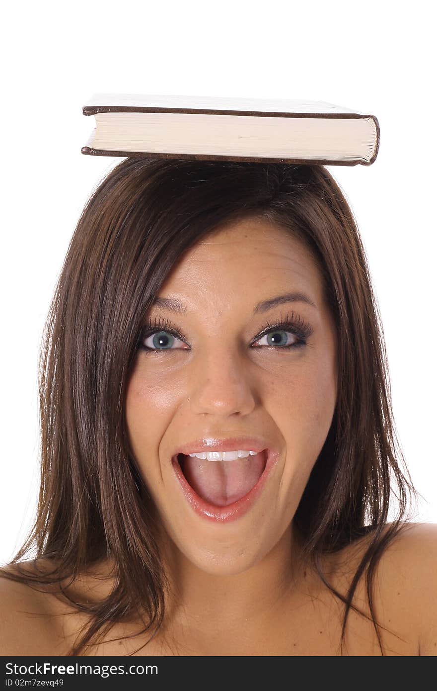 Shot of a happy school girl with book