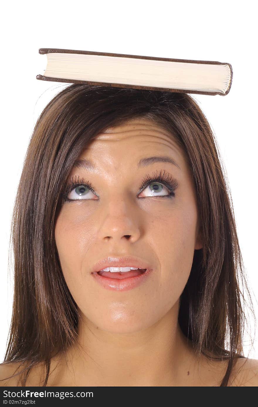 Shot of a beautiful girl looking at book