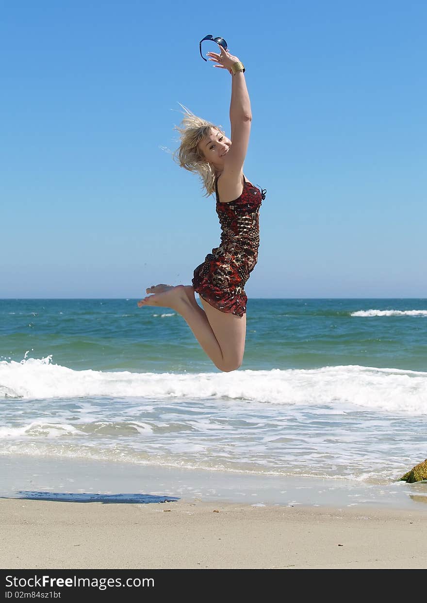 Young blonde woman vacationing at the beach