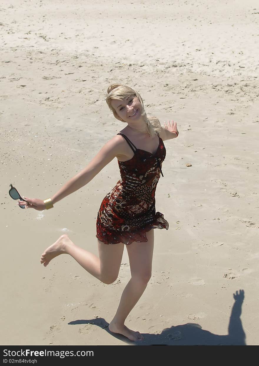 Young blonde woman vacationing at the beach