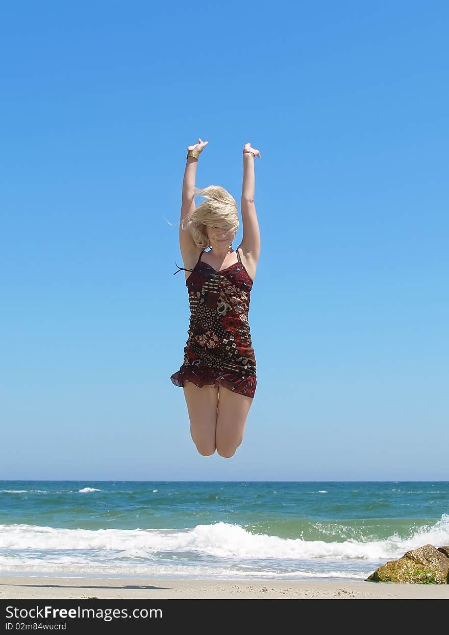 Young blonde woman vacationing at the beach. Young blonde woman vacationing at the beach