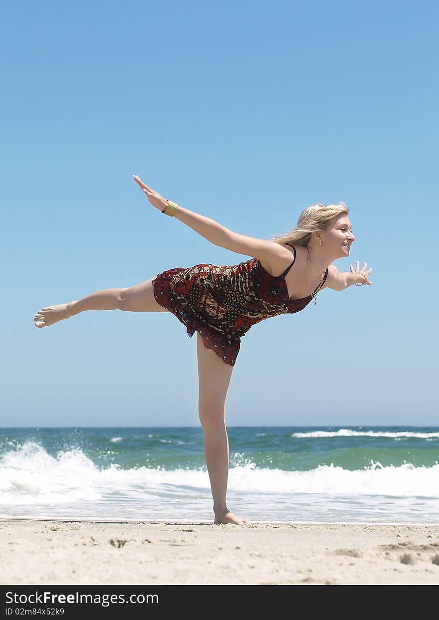 Young blonde woman vacationing at the beach