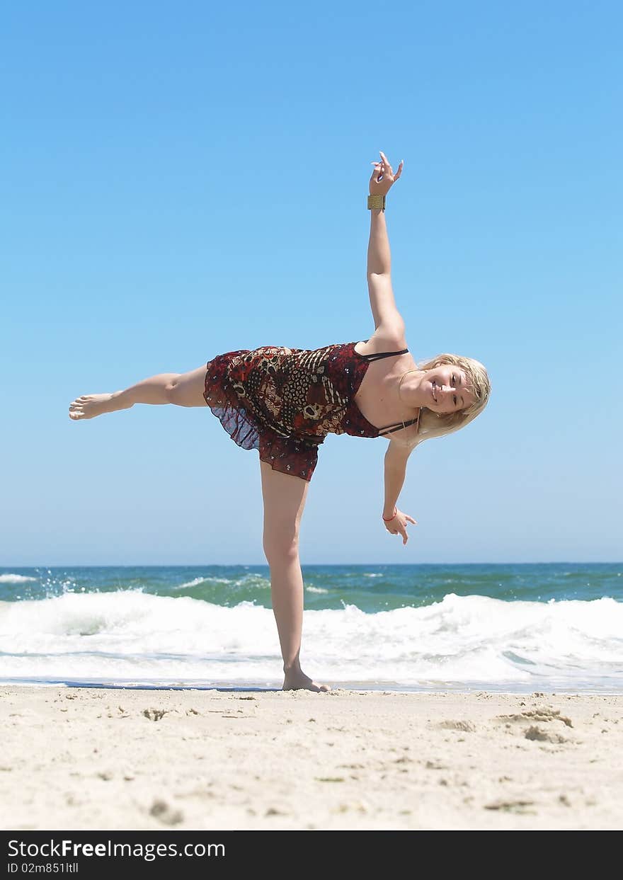 Young blonde woman vacationing at the beach. Young blonde woman vacationing at the beach